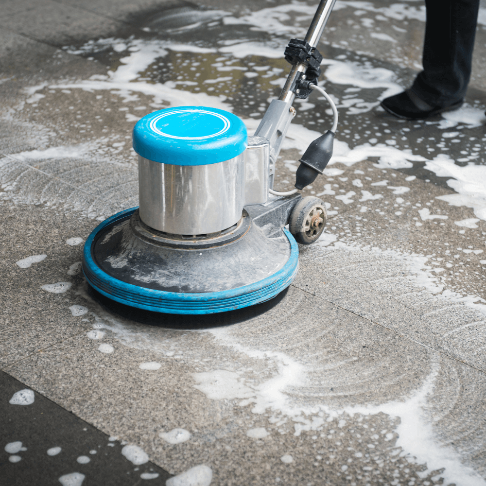 A commercial floor cleaning treatment with a machine