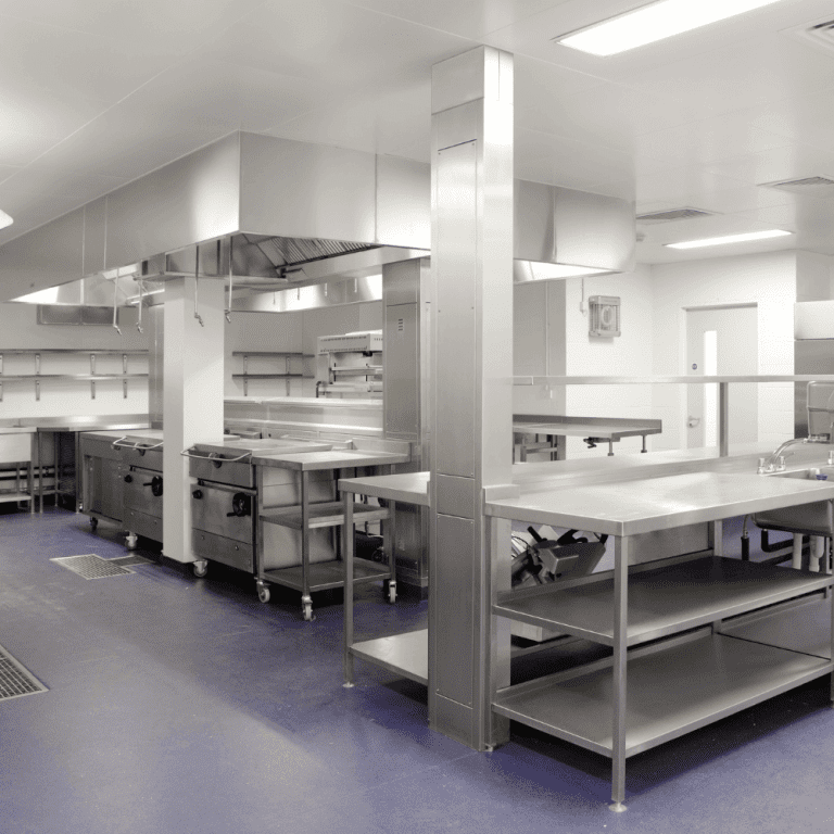 Clean stainless steel shelves and surfaces in a commercial kitchen